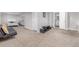 Finished basement offers carpeted floors, recessed lights, modern furniture and interior access at 2905 S Deframe Way, Lakewood, CO 80228