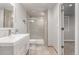 Modern bathroom with walk-in shower, floating shelves, and vanity, plus interior access at 2905 S Deframe Way, Lakewood, CO 80228