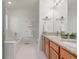 Bathroom with a bathtub and double vanity, offering style and convenience for your daily routine at 2905 S Deframe Way, Lakewood, CO 80228