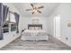 Bright bedroom with a ceiling fan and a serene atmosphere, creating a peaceful retreat at 2905 S Deframe Way, Lakewood, CO 80228