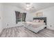 This bedroom has a fan, a window, and great natural light at 2905 S Deframe Way, Lakewood, CO 80228