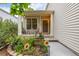 Inviting front porch with seating area surrounded by beautiful flower garden at 2905 S Deframe Way, Lakewood, CO 80228
