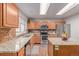 Well-lit kitchen with stainless steel appliances and granite countertops, ideal for culinary enthusiasts at 2905 S Deframe Way, Lakewood, CO 80228