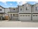 Charming gray home with a two-car garage, porch, and well-maintained landscaping at 4018 Upham St, Wheat Ridge, CO 80033