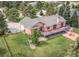 Aerial view of the property showcasing its large lot, well-manicured lawn, and private location at 1660 Old Antlers Way, Monument, CO 80132