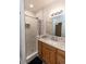 Updated bathroom featuring a tiled shower with glass door and modern vanity at 1660 Old Antlers Way, Monument, CO 80132