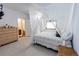 Primary bedroom with a canopy bed, dresser, and attached bath at 1660 Old Antlers Way, Monument, CO 80132