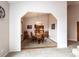 Elegant dining room with a chandelier, wood table and chairs, and open access to the kitchen at 1660 Old Antlers Way, Monument, CO 80132