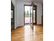 Bright dining room features wood floors and opens to an outdoor deck with mountain views through glass patio doors at 1660 Old Antlers Way, Monument, CO 80132