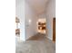Hallway view showing the kitchen with island and a sunlit dining area at 1660 Old Antlers Way, Monument, CO 80132