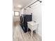 Laundry room featuring modern washer and dryer, utility sink, and storage cabinets at 1660 Old Antlers Way, Monument, CO 80132