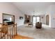 Spacious living room featuring a brick fireplace, vaulted ceilings, and sliding glass doors to a deck at 1660 Old Antlers Way, Monument, CO 80132