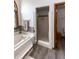Elegant main bathroom features a soaking tub, glass enclosed shower, and wood-style flooring at 1660 Old Antlers Way, Monument, CO 80132