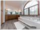 Luxurious bathroom offers a large soaking tub, a vanity with dual sinks, and ample storage at 1660 Old Antlers Way, Monument, CO 80132