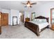 Large main bedroom includes a ceiling fan, closet, and neutral carpeting for comfort and style at 1660 Old Antlers Way, Monument, CO 80132