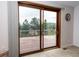 Sliding glass door with a view of a wood deck and treed landscape at 1660 Old Antlers Way, Monument, CO 80132