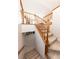 Carpeted staircase with wood railing leading to the lower level at 1660 Old Antlers Way, Monument, CO 80132