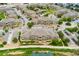 An aerial view of apartment buildings with mature trees and landscaped grounds at 7440 S Blackhawk St # 7-303, Englewood, CO 80112