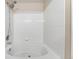 Bright bathroom features a shower head and tiled walls above the tub at 7440 S Blackhawk St # 7-303, Englewood, CO 80112