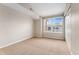 Neutral-toned bedroom with a large window providing lots of natural light at 7440 S Blackhawk St # 7-303, Englewood, CO 80112