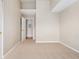 Vacant bedroom with neutral carpet and a door to an ensuite bathroom at 7440 S Blackhawk St # 7-303, Englewood, CO 80112