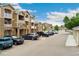 Apartment buildings with balconies overlooking parking and landscaped grounds at 7440 S Blackhawk St # 7-303, Englewood, CO 80112