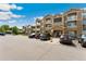 A three-story apartment building showcasing multiple units and balconies at 7440 S Blackhawk St # 7-303, Englewood, CO 80112
