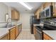 A well-organized kitchen featuring stainless steel appliances and wood cabinetry at 7440 S Blackhawk St # 7-303, Englewood, CO 80112