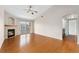 Bright living room features a fireplace, hardwood floors, and sliding glass doors to balcony at 7440 S Blackhawk St # 7-303, Englewood, CO 80112