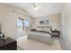 Bedroom with vaulted ceilings, ceiling fan and sliding door access to balcony at 7440 S Blackhawk St # 7-303, Englewood, CO 80112