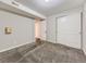 Neutral bedroom with closet, neutral walls, carpeted floors, and a storage area at 14006 E Utah Cir, Aurora, CO 80012