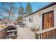 Inviting back deck perfect for outdoor dining, featuring a grill and seating area at 16193 E Dickenson Pl, Aurora, CO 80013