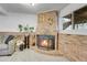 Cozy basement Gathering room featuring a brick fireplace at 16193 E Dickenson Pl, Aurora, CO 80013