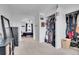 Hallway with views to bedroom and closet, offering an open, airy layout for easy living at 16193 E Dickenson Pl, Aurora, CO 80013