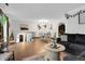 Open dining area with a wooden table, and hardwood floors at 16193 E Dickenson Pl, Aurora, CO 80013