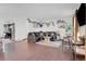 Cozy living room featuring hardwood floors and a comfortable couch at 16193 E Dickenson Pl, Aurora, CO 80013