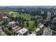 Expansive aerial view of a lush, green park surrounded by city buildings, offering a serene urban oasis at 1201 N Williams St # 3B, Denver, CO 80218