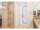 Modern bathroom highlighting a tiled shower, custom cabinetry, and ample natural light at 1201 N Williams St # 3B, Denver, CO 80218