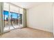 Bedroom with sliding glass doors to a spacious patio with scenic views at 1201 N Williams St # 3B, Denver, CO 80218