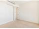 Minimalist bedroom with carpet flooring, white walls, and a large closet with sliding doors at 1201 N Williams St # 3B, Denver, CO 80218