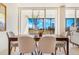 Dining room table with a view of the balcony at 1201 N Williams St # 3B, Denver, CO 80218