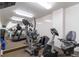 Well-equipped gym with various exercise machines and mirrored walls for a complete workout at 1201 N Williams St # 3B, Denver, CO 80218