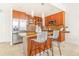 Kitchen with stainless steel appliances, bar seating, and granite countertops at 1201 N Williams St # 3B, Denver, CO 80218