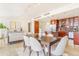 Living room and dining area features a modern lighting fixture at 1201 N Williams St # 3B, Denver, CO 80218