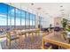 Bright lounge area with floor to ceiling windows with comfortable seating and scenic views at 1201 N Williams St # 3B, Denver, CO 80218
