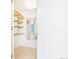 Bright walk-in closet features built-in shelving and a mirror, offering ample storage space at 1201 N Williams St # 3B, Denver, CO 80218