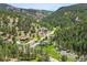 Aerial view of property nestled among trees in the mountains at 1037 Wagonwheel Gap Rd, Boulder, CO 80302