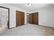 Cozy bedroom with carpet floors, ample closet space and a view of an ensuite bathroom at 1037 Wagonwheel Gap Rd, Boulder, CO 80302