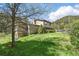 Lovely home nestled in a lush green yard with mature trees and a hill backdrop at 1037 Wagonwheel Gap Rd, Boulder, CO 80302