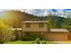 Inviting home exterior with well-maintained landscaping and mature trees at 1037 Wagonwheel Gap Rd, Boulder, CO 80302